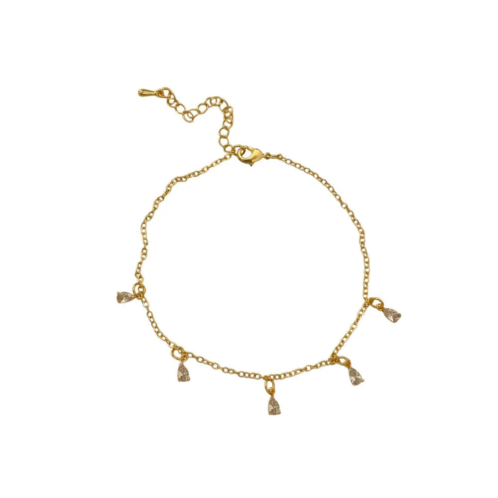 Zircon three-piece jewellery set with geometric meteor shower pendant necklace, matching earrings, and anklet.
