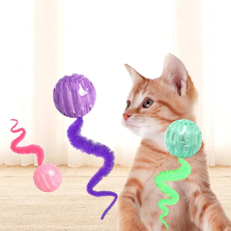Interactive bouncy ball cat toy with plush tail in green, pink and purple colour options