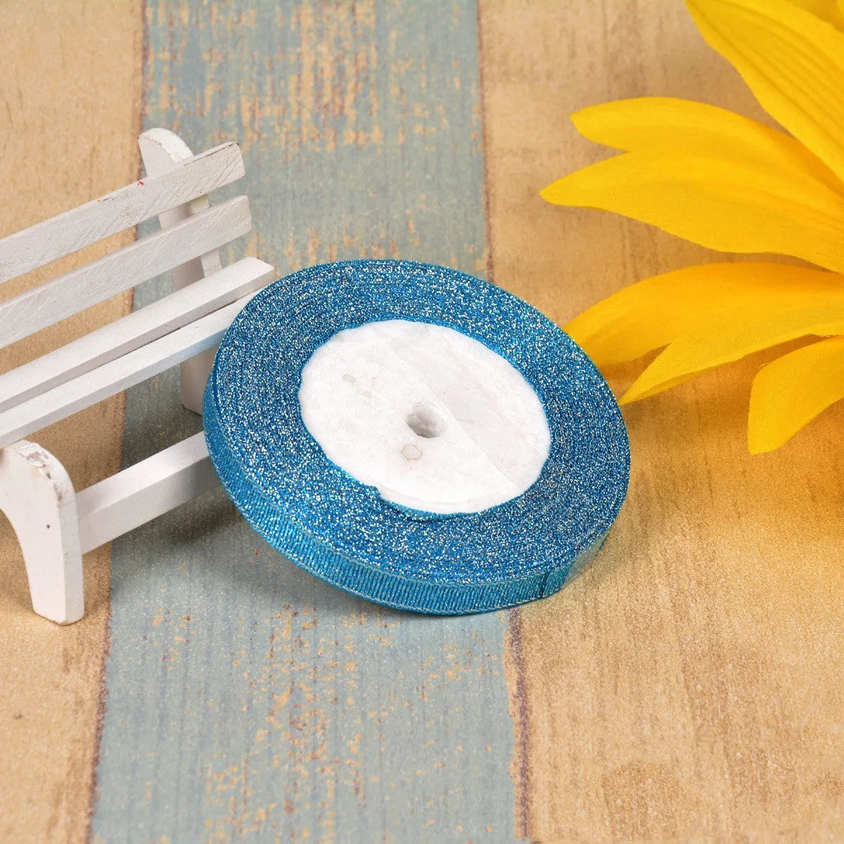 A roll of colourful green onion pattern polyester ribbon with metallic wire highlights, shown at 3-points width.