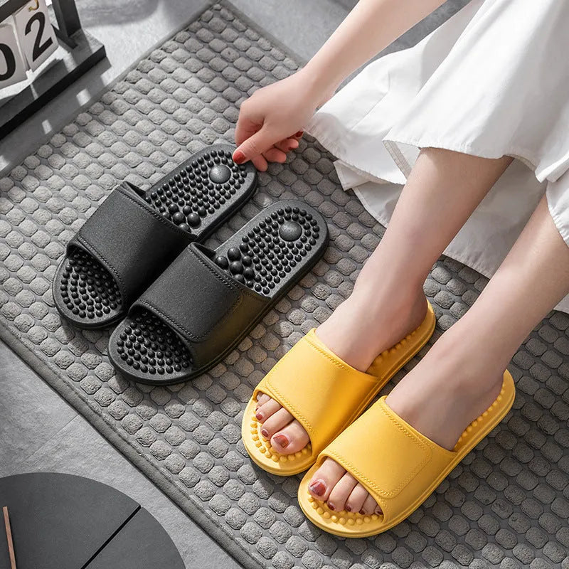 Pair of non-slip PVC massage slippers with breathable upper and wear-resistant injection-moulded sole, available in seven colours.