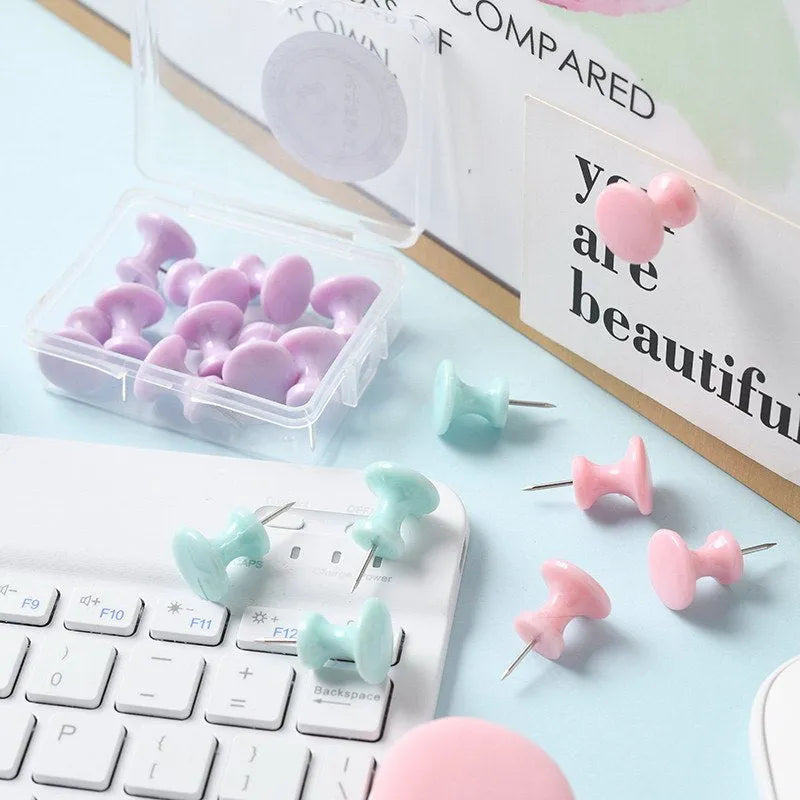 Boxed plastic push pins in macaron colours: cherry blossom pink, mint green, and lavender in large and small sizes