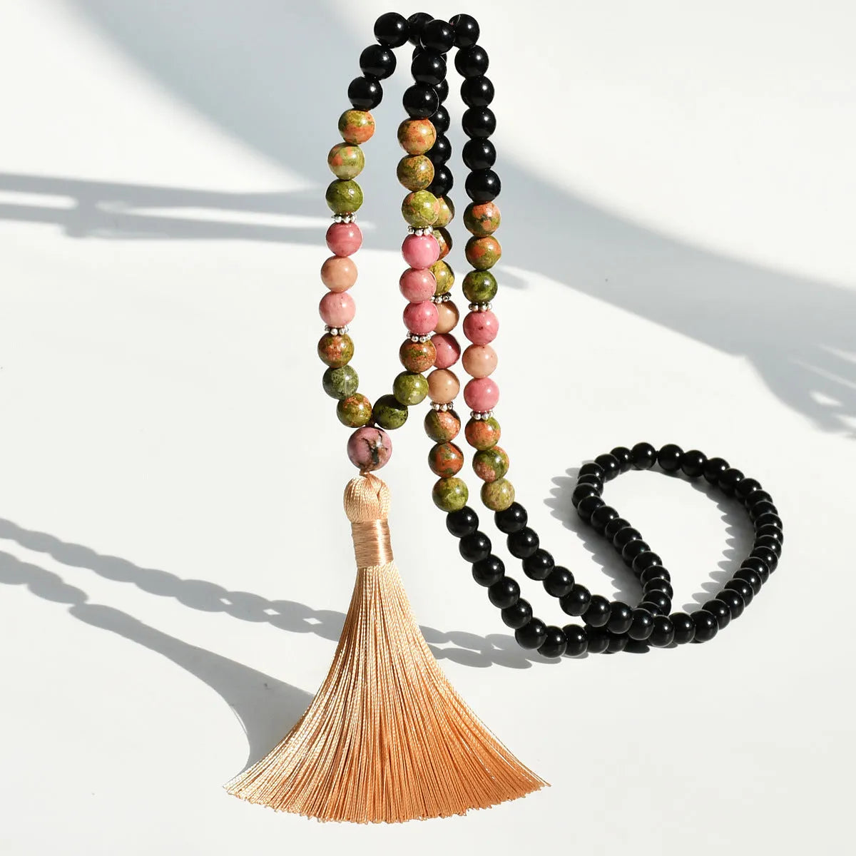 Long beaded bohemian necklace with 108 natural stones, a geometric pendant, and colourful tassels on an 81cm chain.
