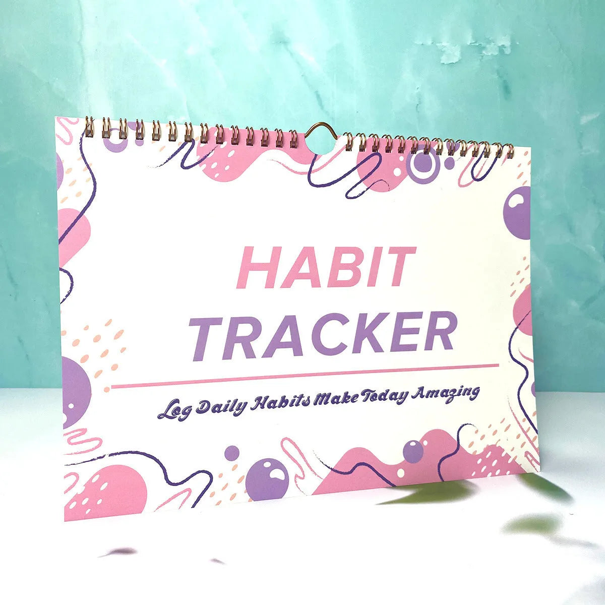 Habit tracking journal with 12 pages measuring 21cm by 28cm in four colour options