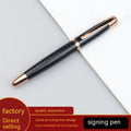 Grey metal retractable roller pen for business signatures on a white background.