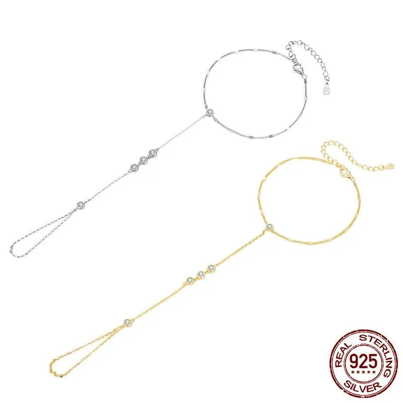 S925 sterling silver tassel bracelet with integrated ring and chain, shown in silver or gold electroplated finish
