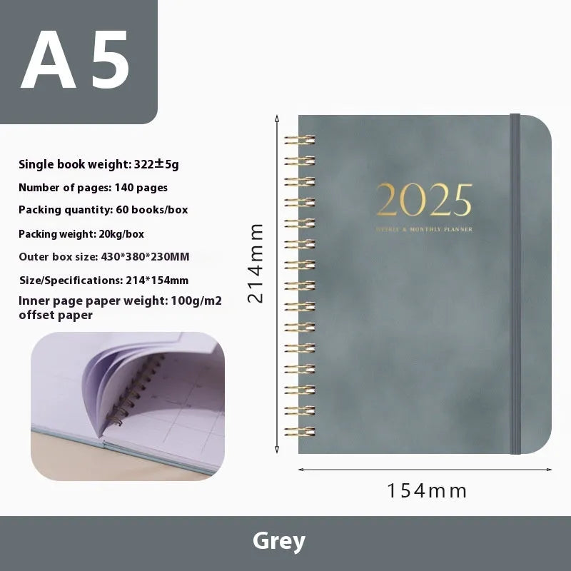 A5 leather notebook with metal coil binding in various colours including black, blue, and green.