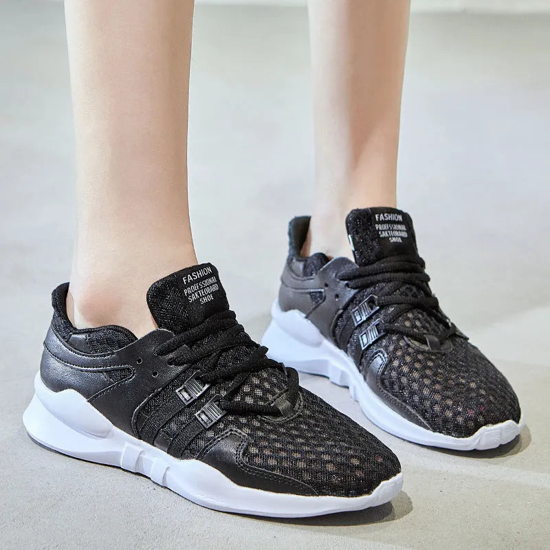 Breathable hollow mesh sneakers in black and white colours with round toe design