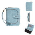 Women's black PU leather zipper coin purse with card slots open, showing interior.