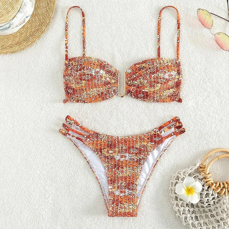 Women's high-waist floral bikini swimsuit in a solid colour on a mannequin