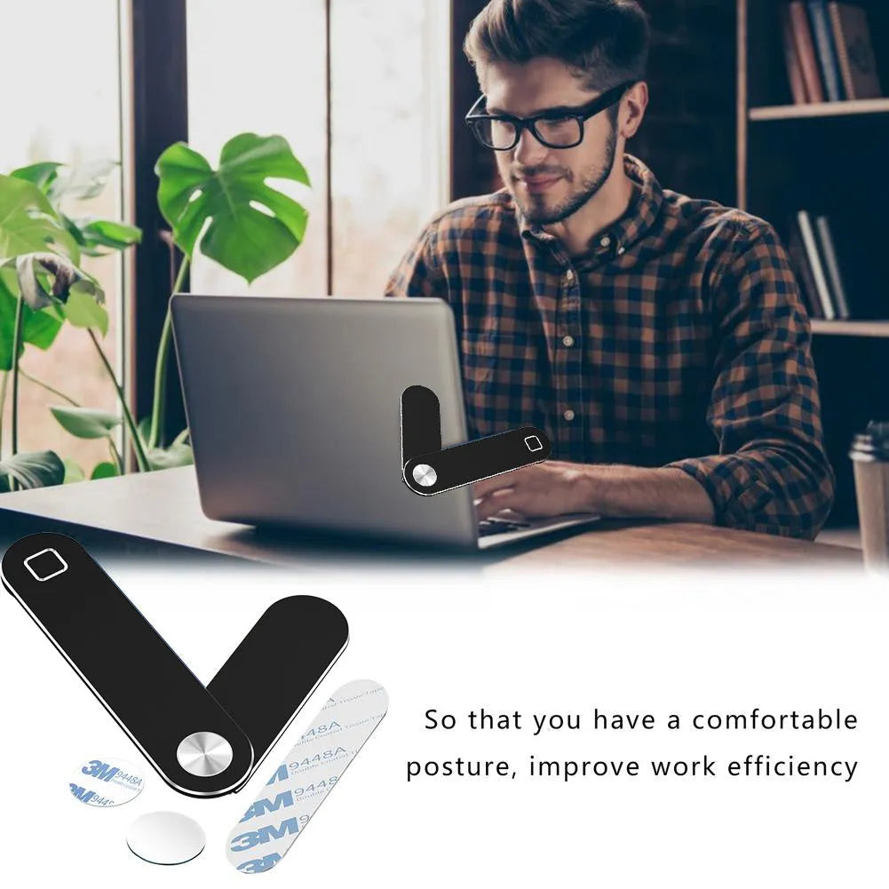 Black aluminum laptop phone holder clipped to a monitor, holding a smartphone and with headphones hanging from the hook.