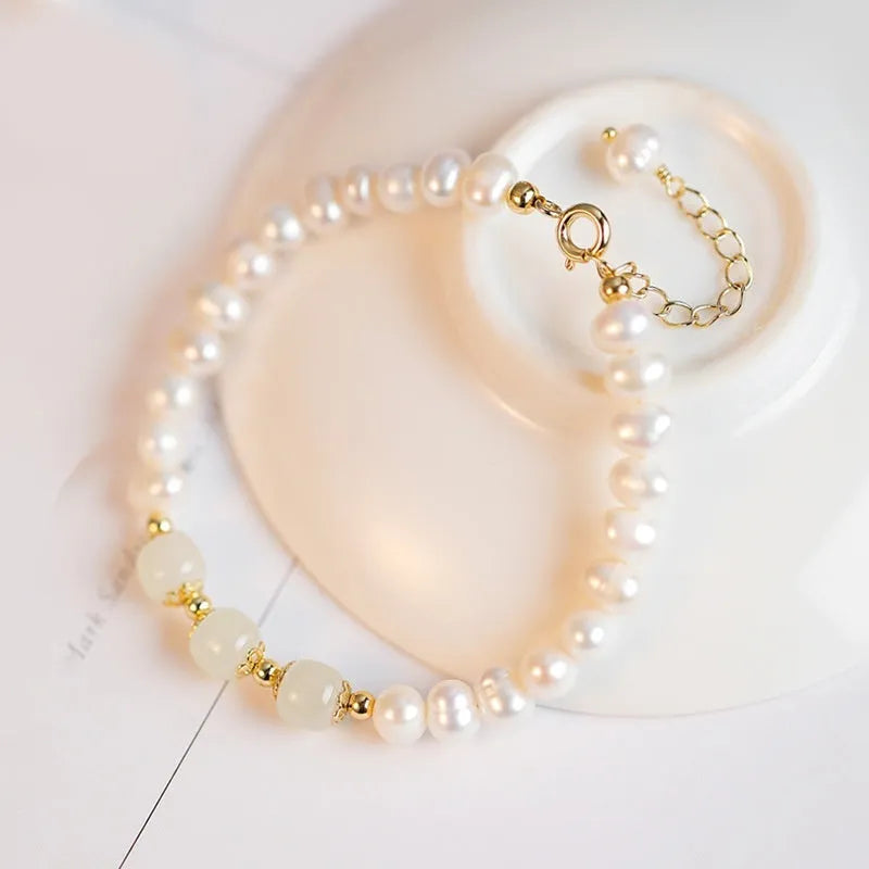 Freshwater pearl bracelet with diamond-shaped charm in electroplated Hetian jade colour