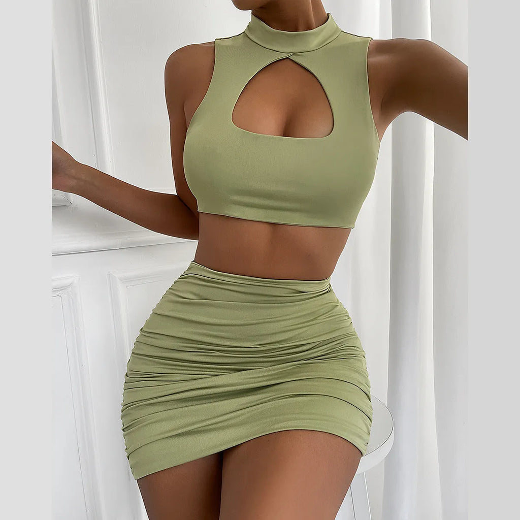 Women's light purple hollow vest and matching split hip skirt two-piece set on a mannequin