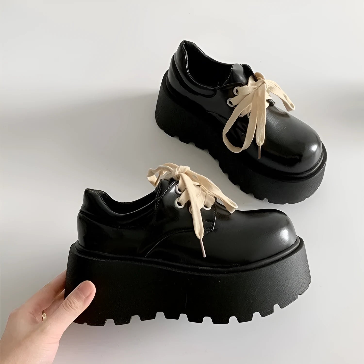 Matte black women's lace-up shoes with a chunky rubber sole and 6-8cm heel.