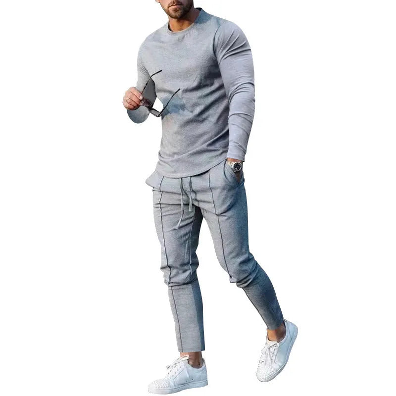 Men's light grey two-piece suit set with long sleeve round neck t-shirt and matching trousers.