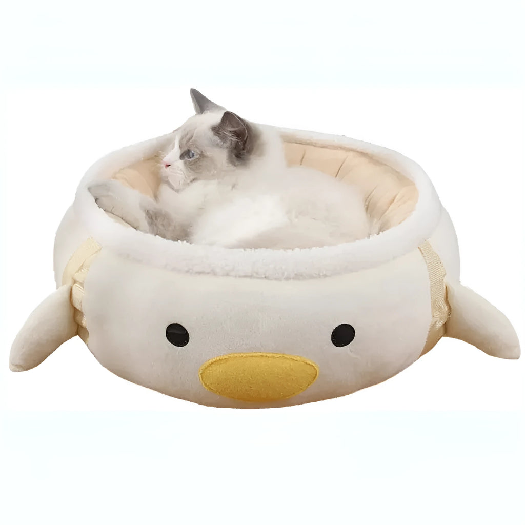 Green dinosaur-shaped cat bed shown both as a flat sofa and hanging as a hammock for a cat.