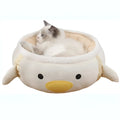 Green dinosaur-shaped cat bed shown both as a flat sofa and hanging as a hammock for a cat.