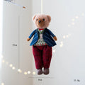 A soft cloth plush bear doll showing two colour options: a princess bear and a gentleman bear with a plaid suit.