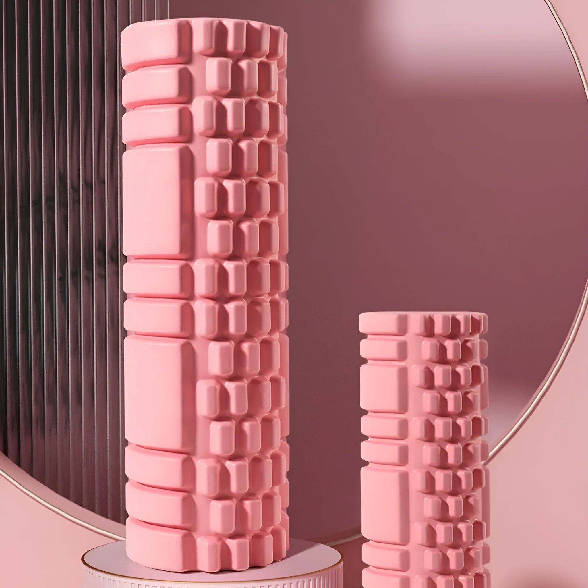EVA foam roller for fitness in black, shown on a wooden floor.