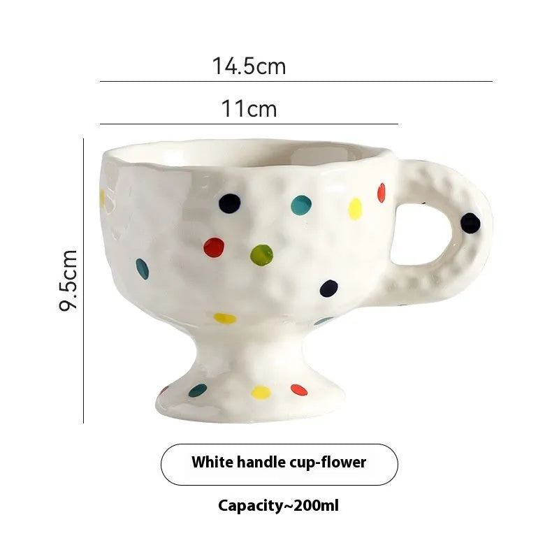 Hand-pinched irregular ceramic mug in solid colour with modern design and 14.5cm height
