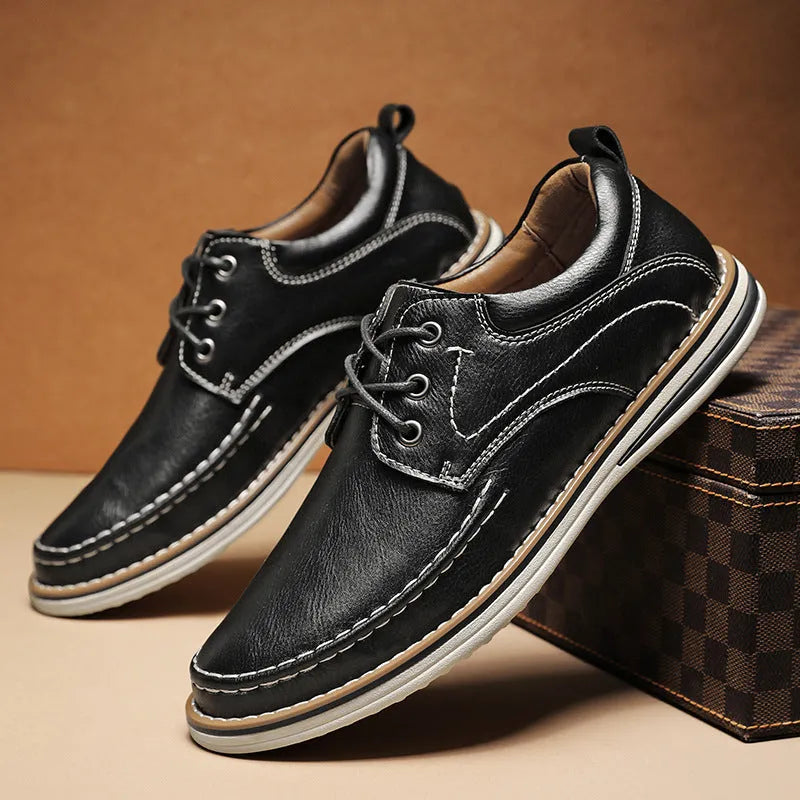Men's genuine cowhide leather casual shoes in black with round toe and front lace-up design on a neutral background