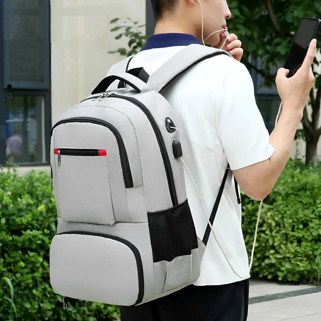 Insulated Oxford cloth picnic backpack in grey, showing main compartment and curved shoulder strap.
