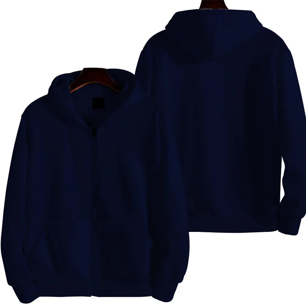 Man wearing a solid colour loose-fit zip-up sports jacket in a casual setting.