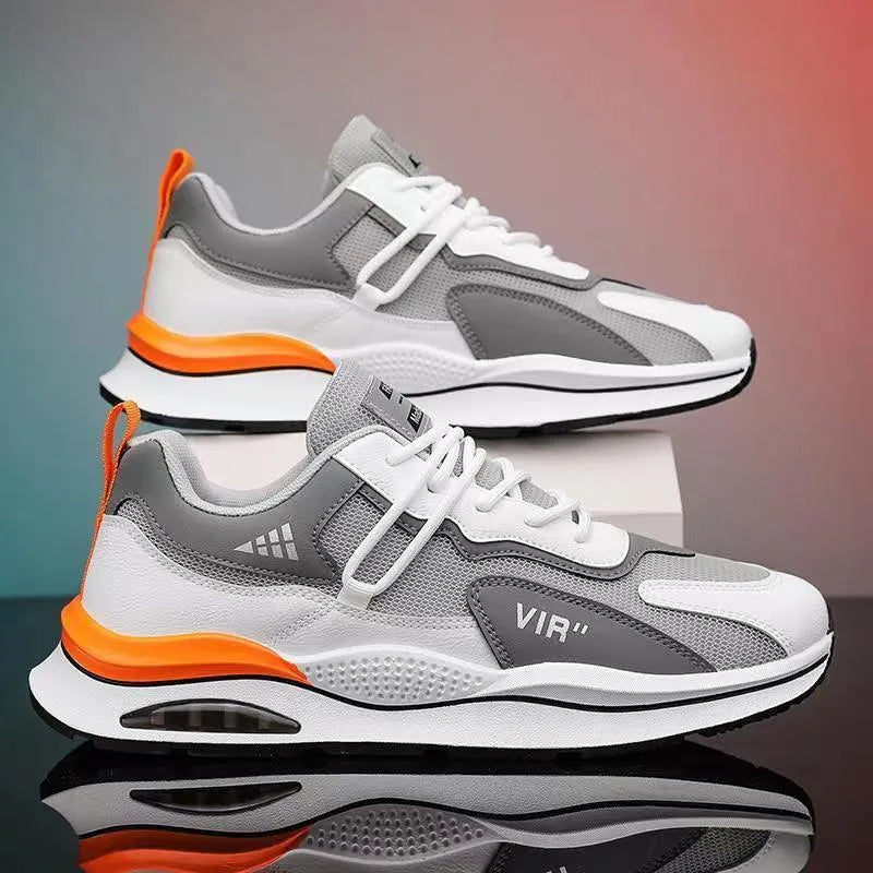 Men's grey mesh running shoes with round toe and middle top design on light background
