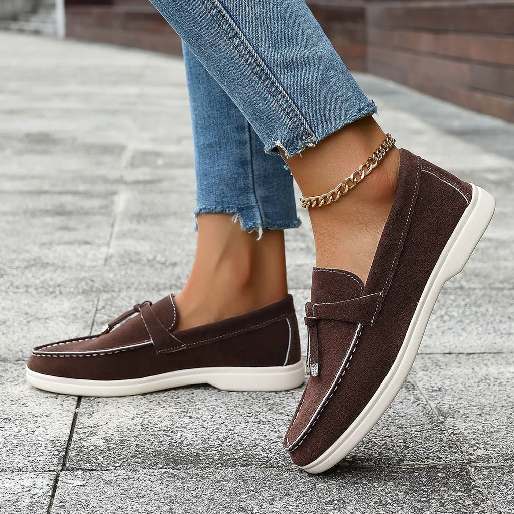 Women's casual tassel one pedal loafers in brown with round toe and low flat heel on a white background