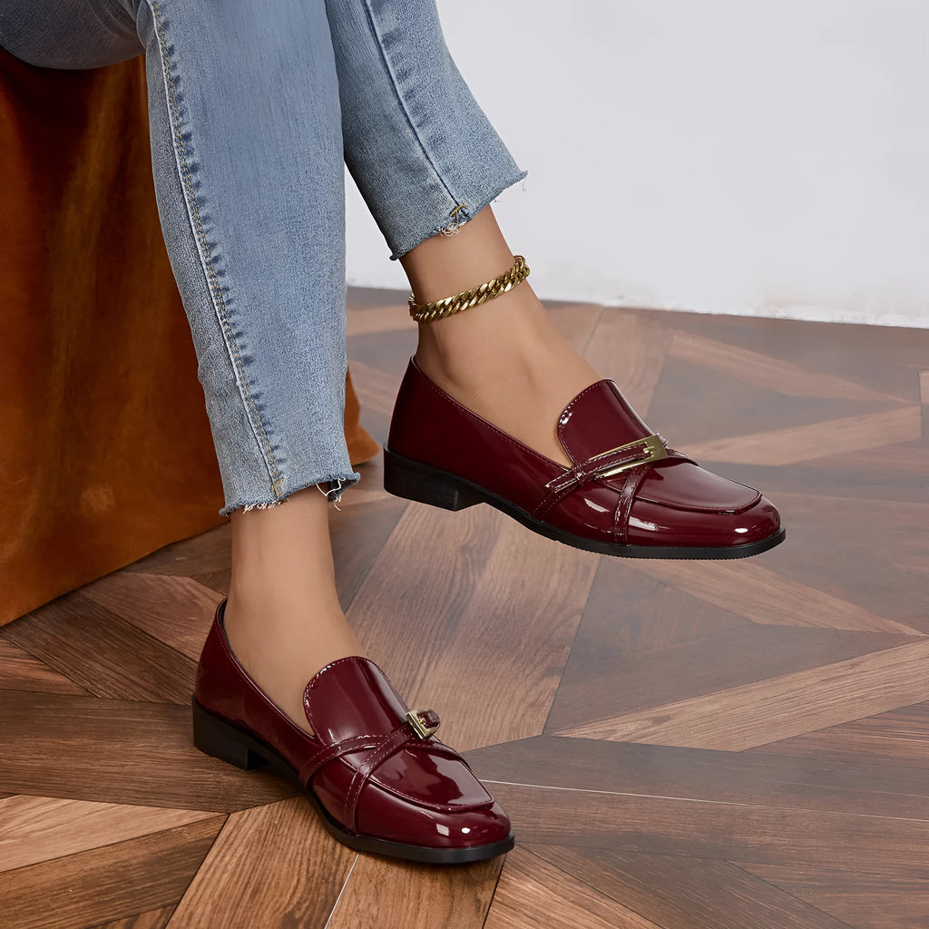 Patent leather square toe loafers in black with low heel and rubber sole