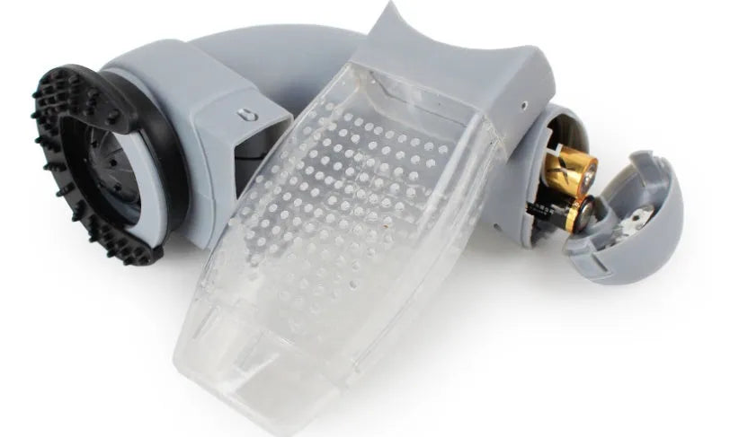 Grey handheld electric pet hair remover vacuum brush with soft rubber head.