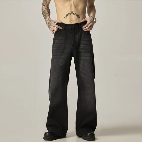 Black loose straight jeans with retro styling and zipper fly on mannequin