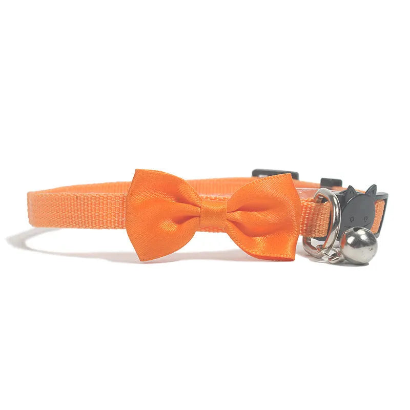 Adjustable nylon cat bow collar with a bell in a striped pattern, shown in a bright colour.