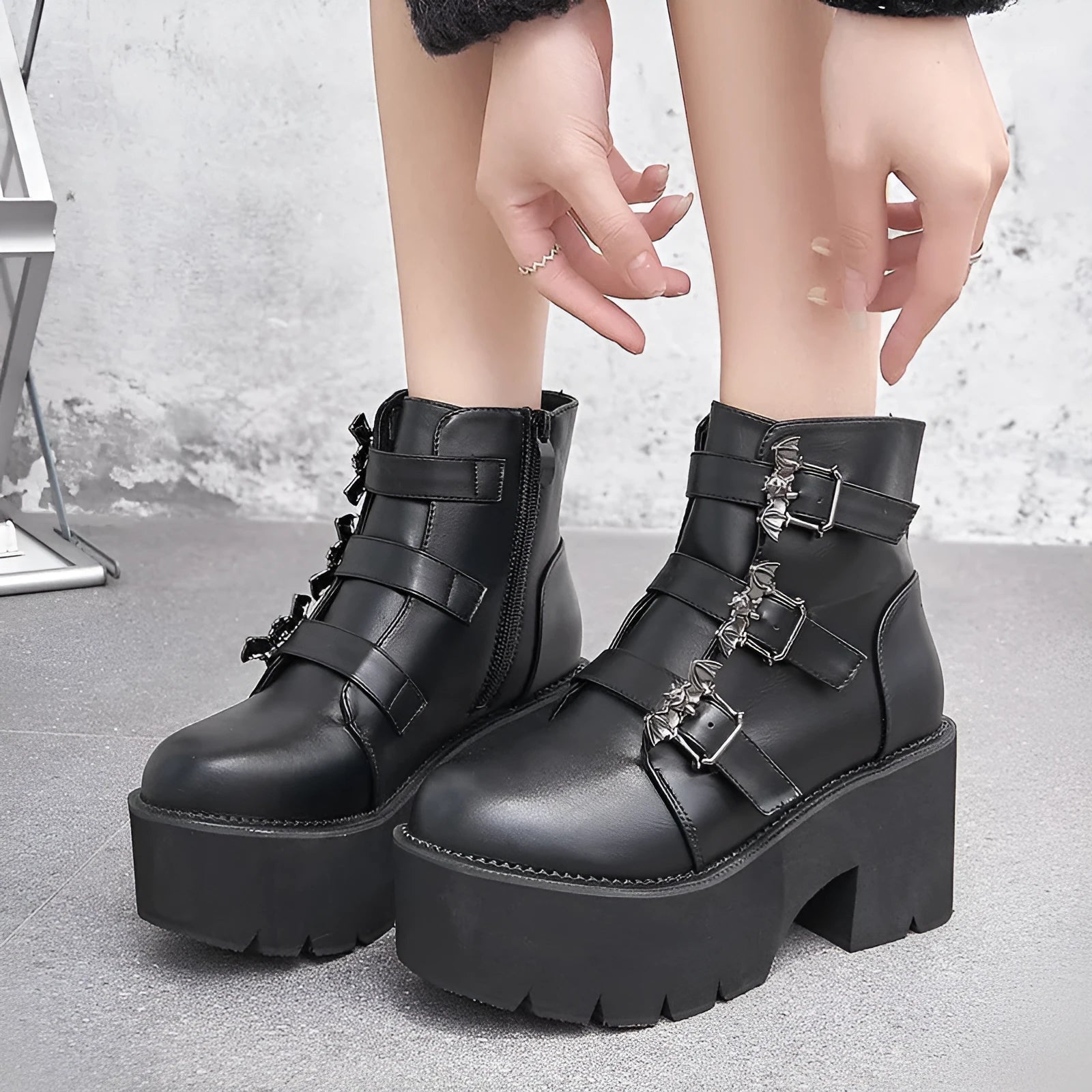 Black women's punk style Martin boots with a side zipper and thick heel.