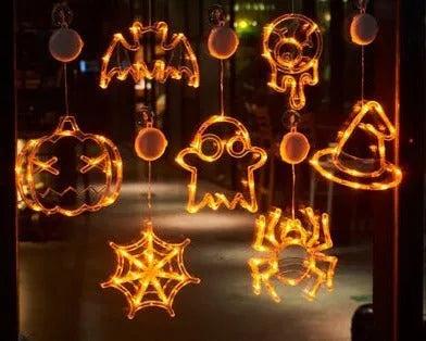 Halloween LED hanging lights with spider, pumpkin and ghost designs featuring suction cups for window mounting