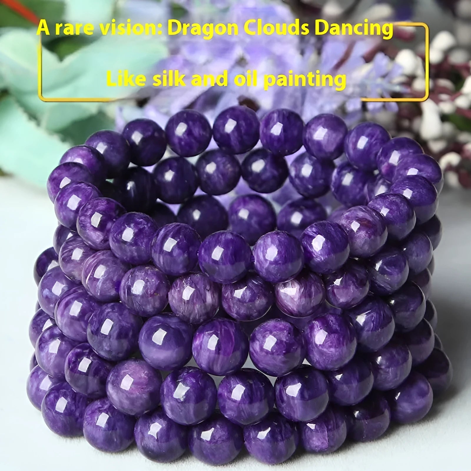 Natural transparent charoite crystal bracelet with platinum-coloured clasp on a wrist.