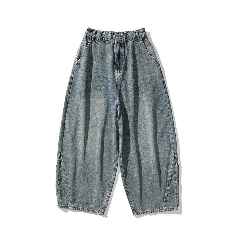 Man wearing plus size light blue wide leg baggy jeans, low waist straight leg casual style.