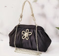 Women's soft polyester shell-shaped messenger bag in lavender purple with folds, diamond patterns, and a chain detail.