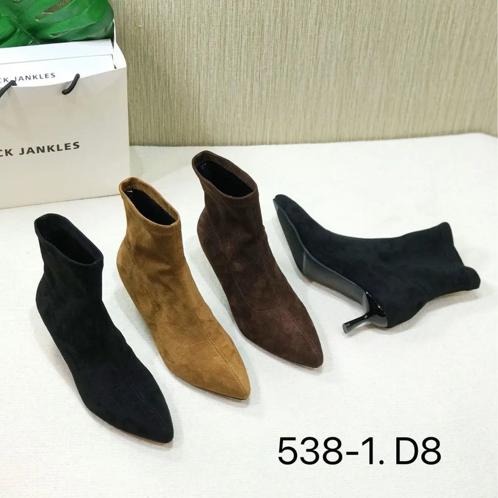 Women's black pointed toe ankle boots with a stiletto heel on a rubber sole.