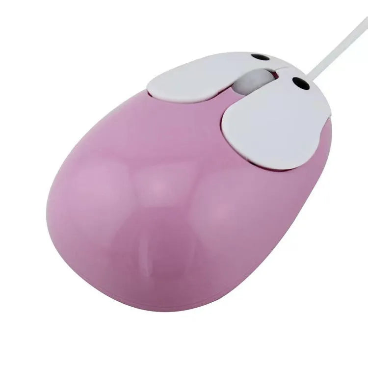 Pink wired rabbit mouse on desktop with USB cable and scroll wheel