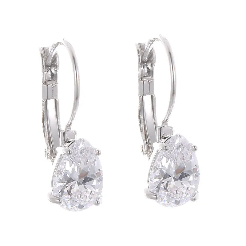 A pair of women's drop-shaped copper earrings with gemstone inlay, shown in gold and platinum colour options.