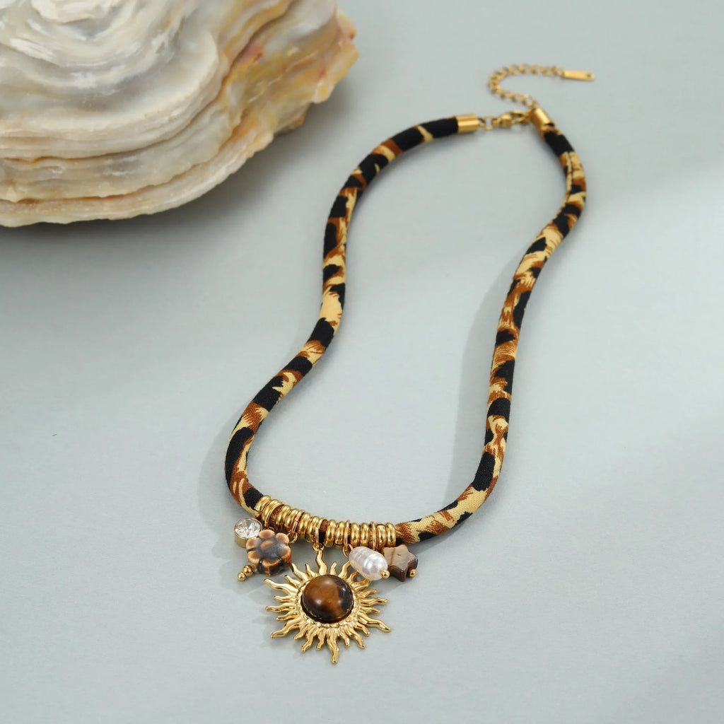 Geometric leopard pendant necklace with electroplated 18K gold finish on stainless steel chain