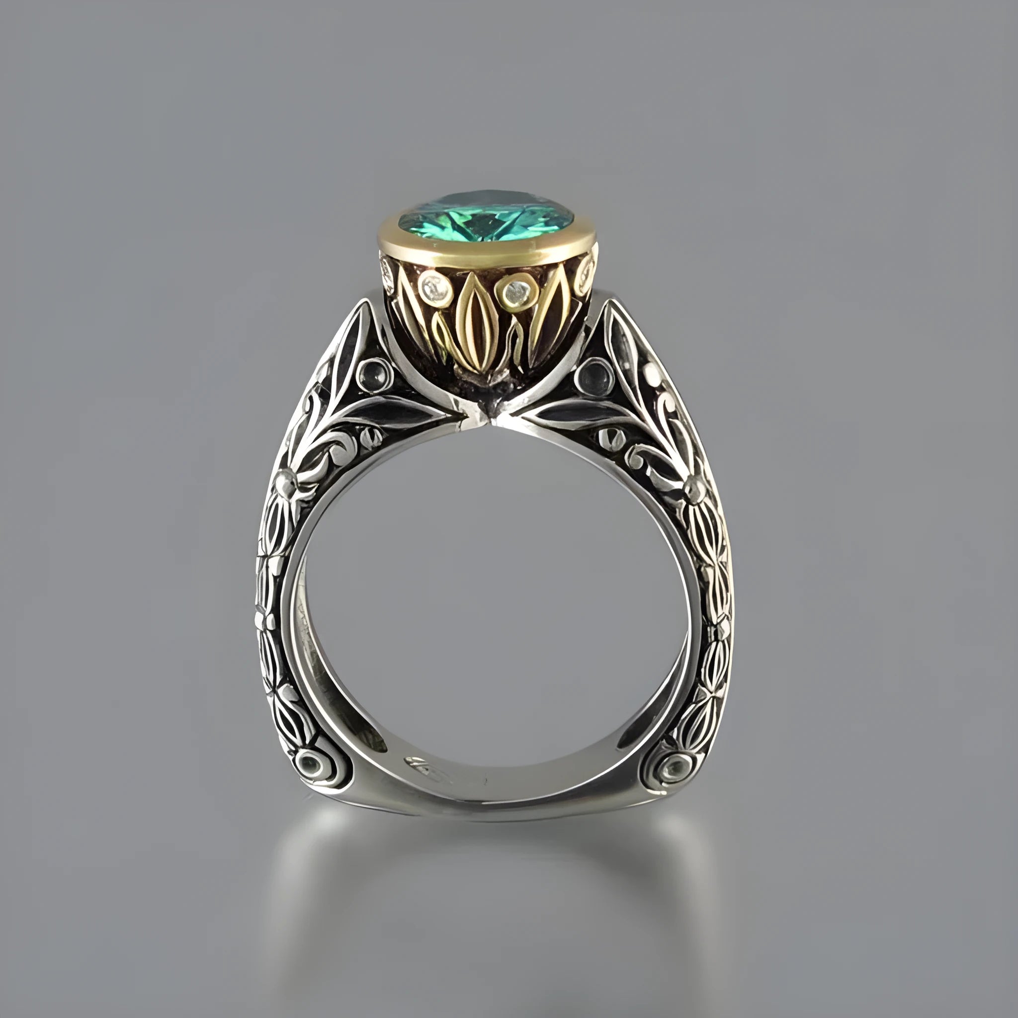 Flower-shaped gold-plated vintage ring with green gemstone and colour separation design on finger