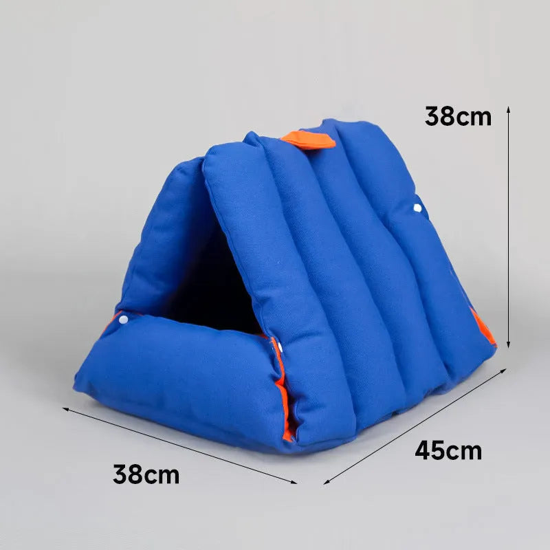 Blue triangular fabric cat bed with a sofa shape and visible connection holes on the sides.