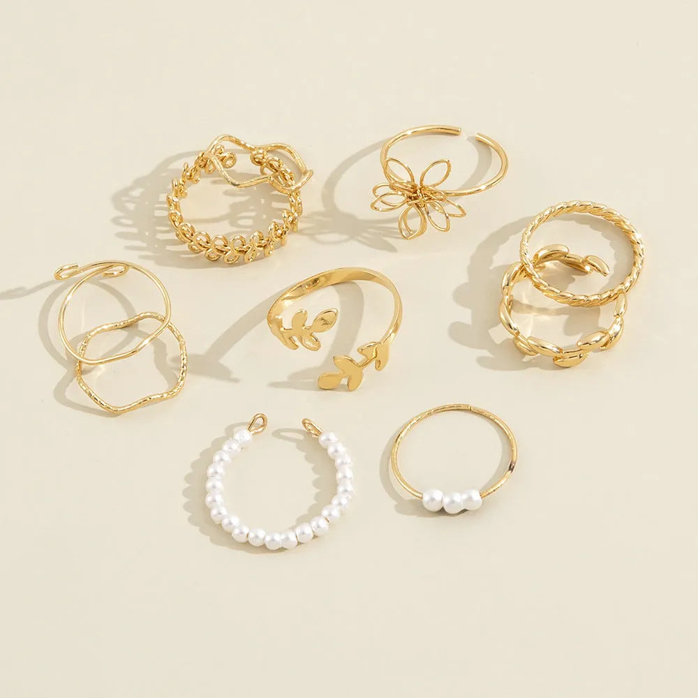 Gold openwork flower ring with alloy construction and electroplated glossy finish