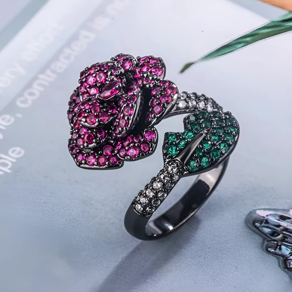 Gold-plated copper ring with geometric flower design and simulation red corundum in black gold finish