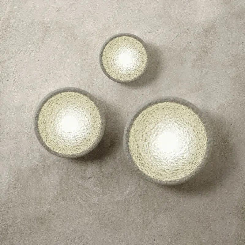 Japanese-style minimalist wall lamp with resin shade in three diameter sizes for modern interiors