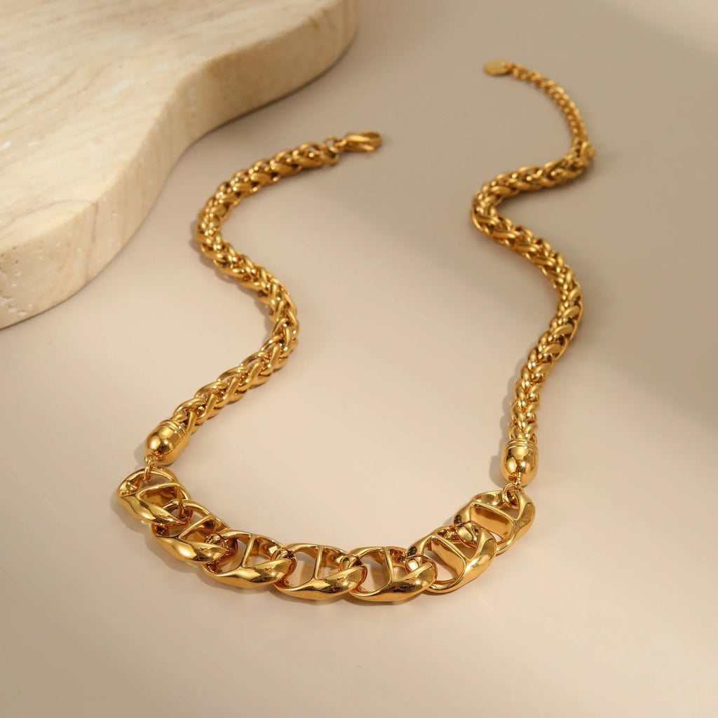 Stainless steel geometric chain necklace with 18K gold plating in gold or steel finish.