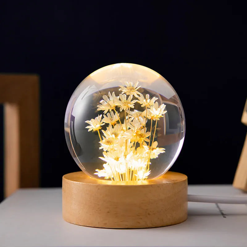 Dandelion crystal ball night light with wooden base, showing preserved flowers inside a 6cm resin sphere.