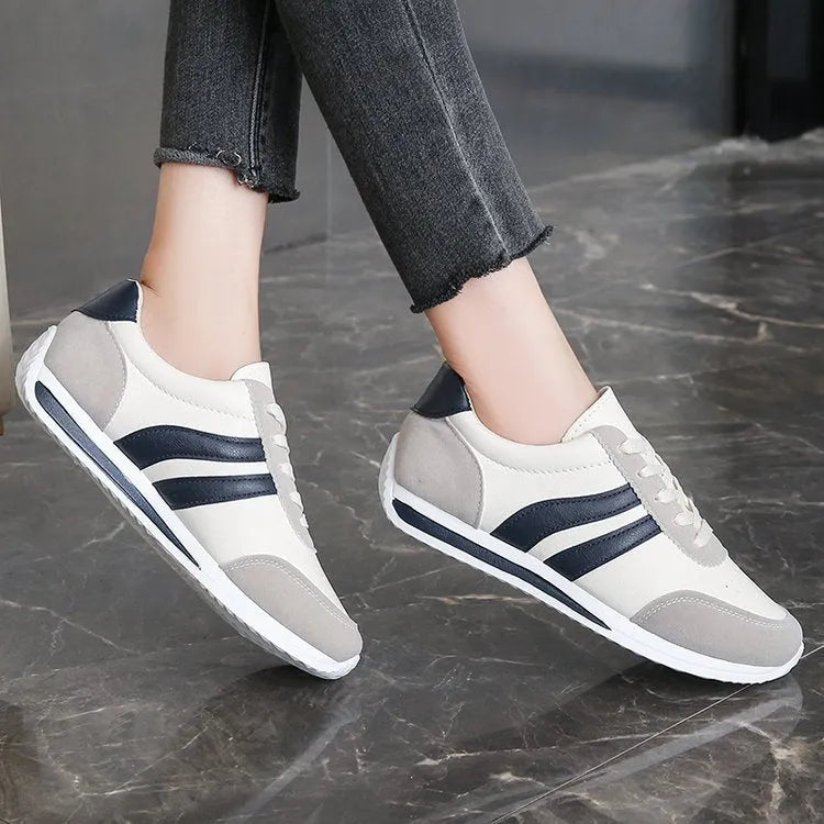 Blue lace-up leisure sneaker with low top design and round toe on rubber sole