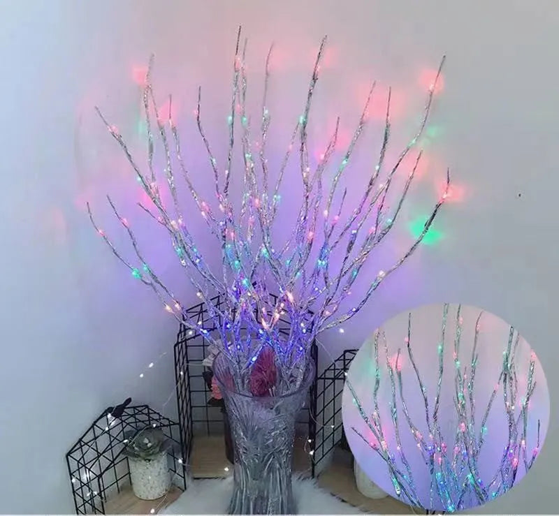 LED decorative tree light in a vase with colourful or warm white lighting options.